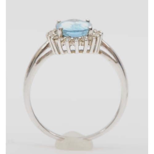 164 - A 9ct white gold aquamarine and eight cut diamond cluster ring, R-S, 3.1gm.