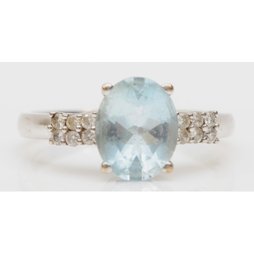 165 - A 9ct white gold aquamarine and brillaint cut diamond dress ring, R, 3.2gm.