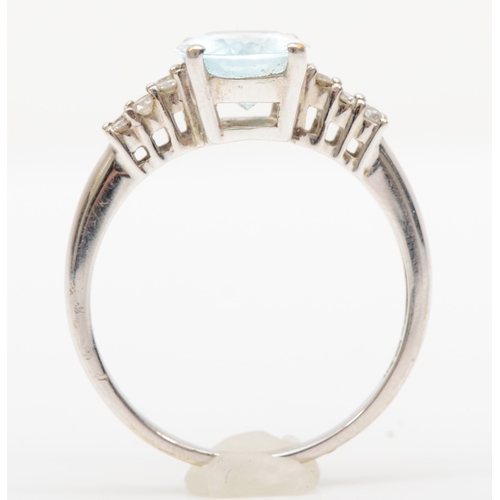 165 - A 9ct white gold aquamarine and brillaint cut diamond dress ring, R, 3.2gm.