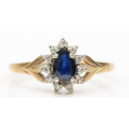 173 - A 9ct gold pear cut sapphire and diamond cluster ring, N-O, 1.5gm.