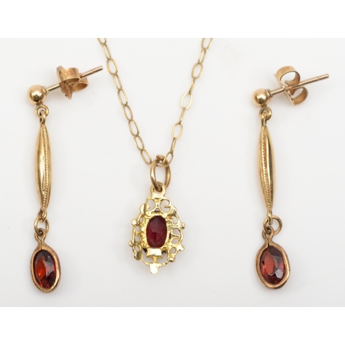 174 - An unmarked gold garnet pendent on 9ct gold chain, 13mm, together with a pair of 9ct gold garnet dro... 