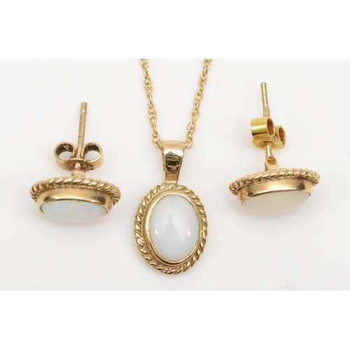 176 - A 9ct gold opal pendent on 375 chain, 15mm, together with a 9ct gold pair of matching stud earrings,... 