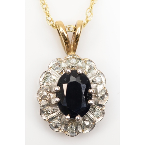 184 - A 9ct gold sapphire and illusion set diamond pendant, on 9k gold chain, 18 x 11mm, 2gm.