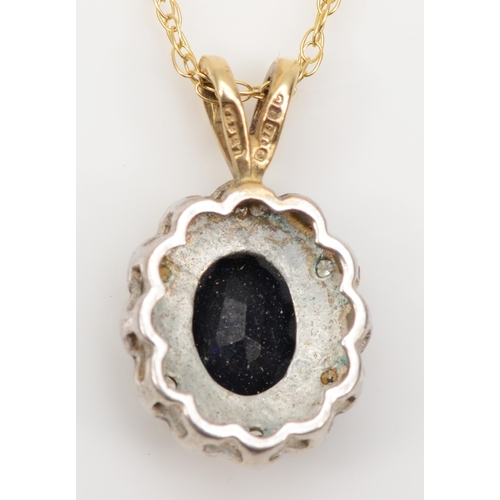 184 - A 9ct gold sapphire and illusion set diamond pendant, on 9k gold chain, 18 x 11mm, 2gm.