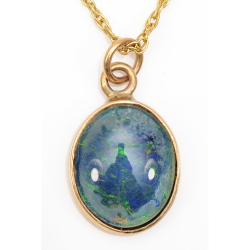 194 - An unmarked gold black opal triplet pendant, on 9ct gold chain, 17 x 11mm, 3gm.