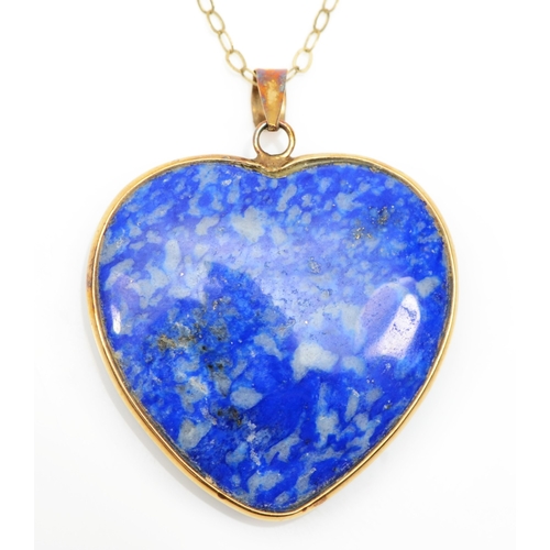 205 - A 375 gold mounted heart shaped lapis lazuli pendant, on 9k fine link chain, 27 x 25mm, 6.5gm.