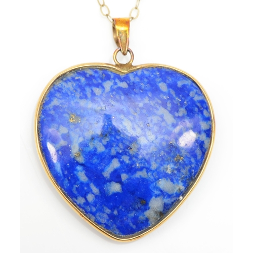 205 - A 375 gold mounted heart shaped lapis lazuli pendant, on 9k fine link chain, 27 x 25mm, 6.5gm.