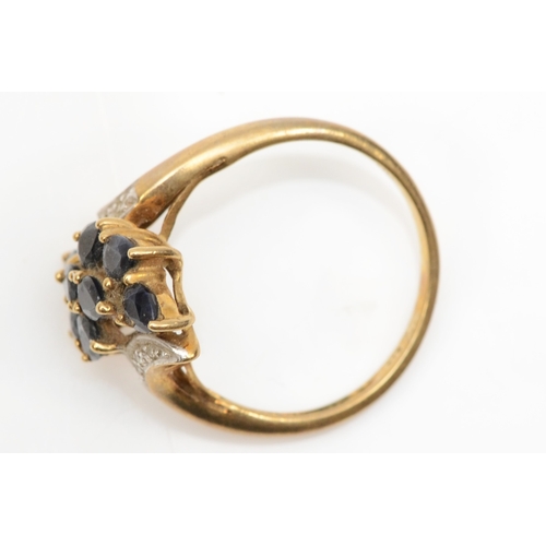 214 - A 9ct gold sapphire and eight cut diamond dress ring, P-Q, 2.9gm.