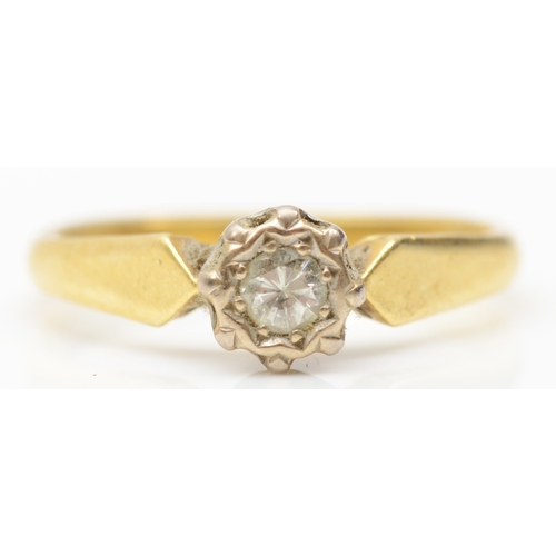 217 - An 18ct gold brilliant cut illusion set diamond solitaire ring, stated weight .10, L, 2.6gm.