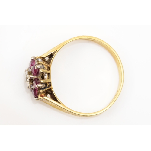 218 - An 18ct gold ruby and illusion set diamond cluster ring, N-O, 3.5gm.