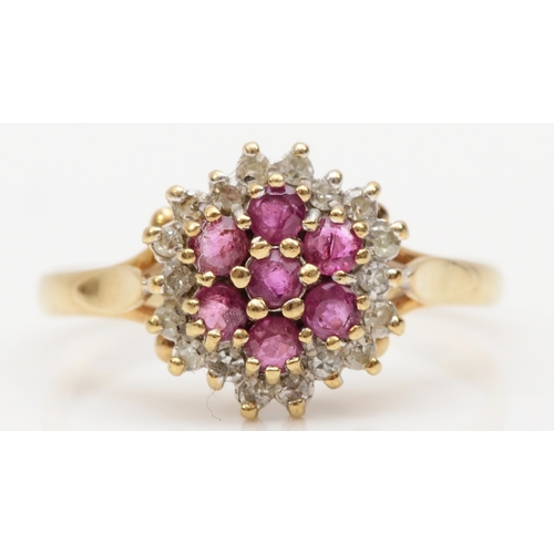 221 - A 9ct gold ruby and eight cut diamond floral cluster ring, L, 2gm.