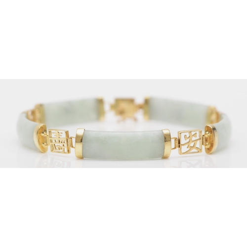 A 9ct gold jadeite paneled bracelet with Chinese characters, 19.5cm, 10.8gm.