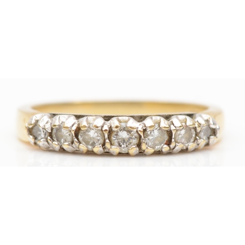 227 - A 9ct gold seven stone brilliant cut diamond dress ring, K, 1.8gm.