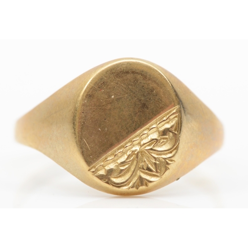 229 - A 9ct gold signet ring with chased decoration, V, 2.2gm.