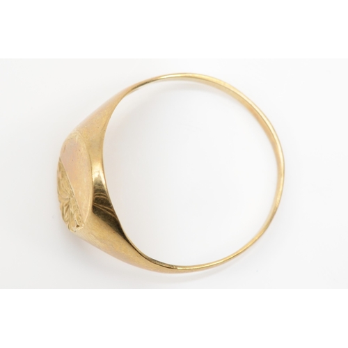 229 - A 9ct gold signet ring with chased decoration, V, 2.2gm.