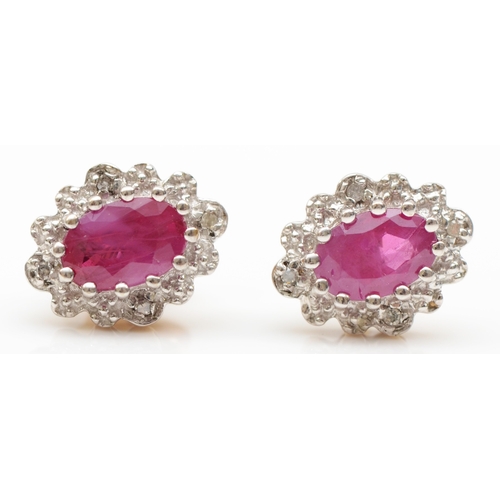 231 - A pair of 375 gold ruby and eight cut diamond cluster stud earrings, 10 x 8mm, 1.7gm.