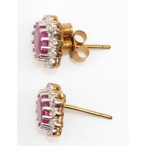 231 - A pair of 375 gold ruby and eight cut diamond cluster stud earrings, 10 x 8mm, 1.7gm.