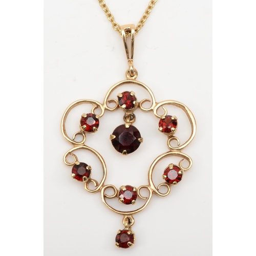 237 - A vintage 9ct gold garnet open work pendant, on 9k chain, Birmingham 1975, 46 x 27mm, 6.8gm.