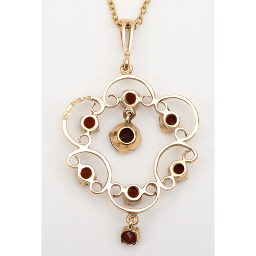 237 - A vintage 9ct gold garnet open work pendant, on 9k chain, Birmingham 1975, 46 x 27mm, 6.8gm.