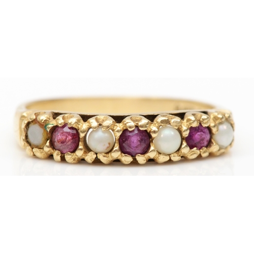 238 - A 9ct gold ruby and seed pearl dress ring, Q, 2.3gm.