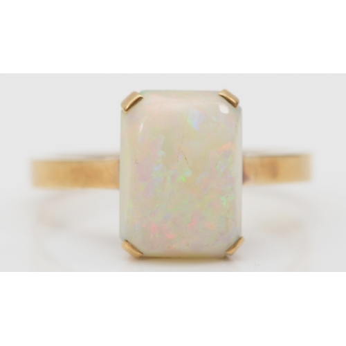 249 - A 9ct gold opal dress ring, flashes of red, blue and green, N, 2.7gm.