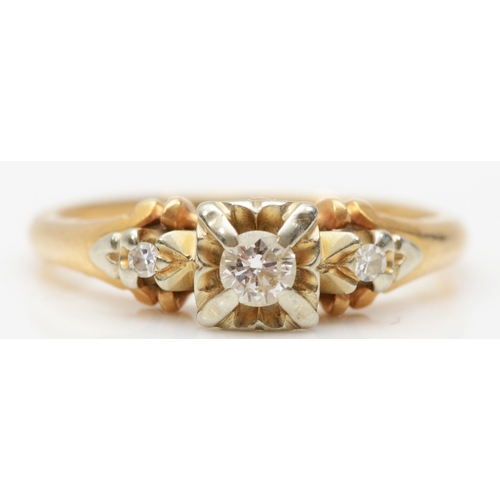 264 - A 14k gold three stone diamond ring, central stone brilliant cut flanked by two eight cut diamonds, ... 