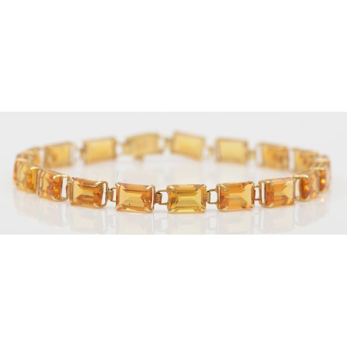 269 - A 14k gold emerald cut citrine tennis bracelet, 19cm, 6.1gm.