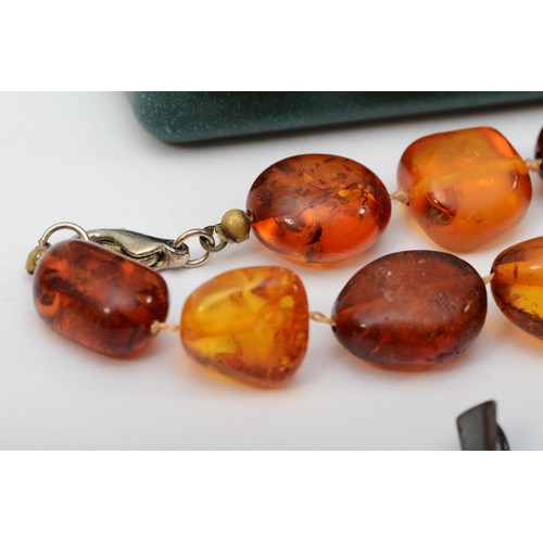 276 - A group of silver Baltic amber jewelry to include a ring Q, a bracelet 20cm, and a beaded necklace.