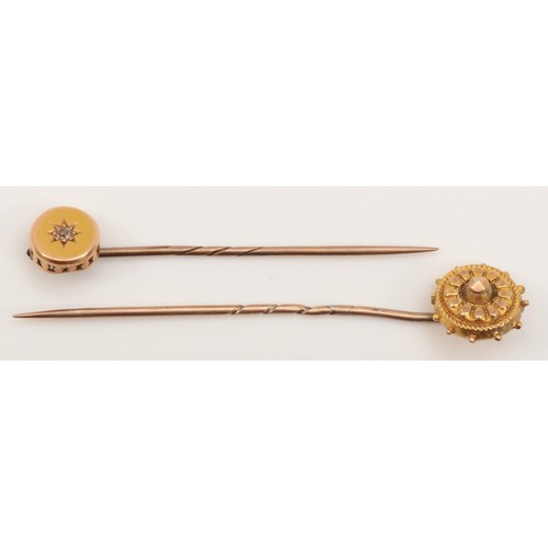 278 - A Victorian 9ct gold target stick pin, 6cm, 1gm, together with an unmarked gold eight cut diamond st... 