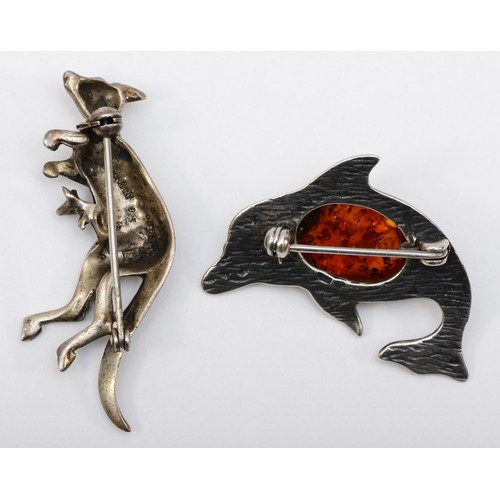 149 - A German silver and marcasite kangaroo brooch, 46 x 30mm, together with a Baltic amber and silver do... 