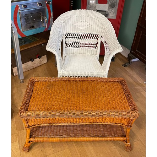 4 - A modern Lloyd loom style armchair, together with a wicker coffee table, 89x47cm. (2)