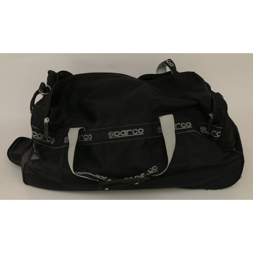 143 - Travel bags to include, two Sparco, large, black, used but good condition. One Ellesse black bag. On... 