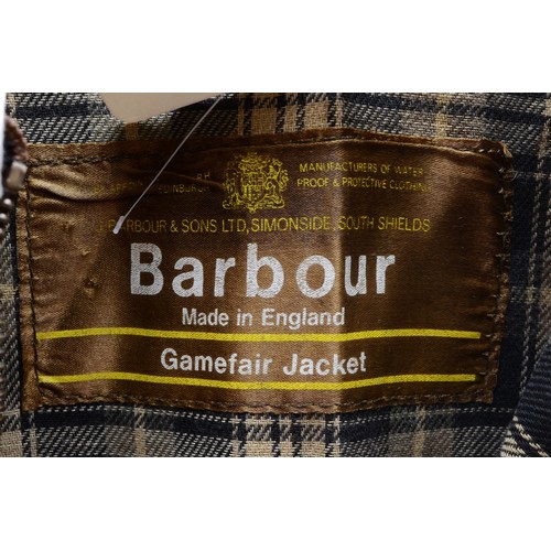 152 - Barbour brown wax game fair jacket with green, navy, cream checked lining. Size XL.