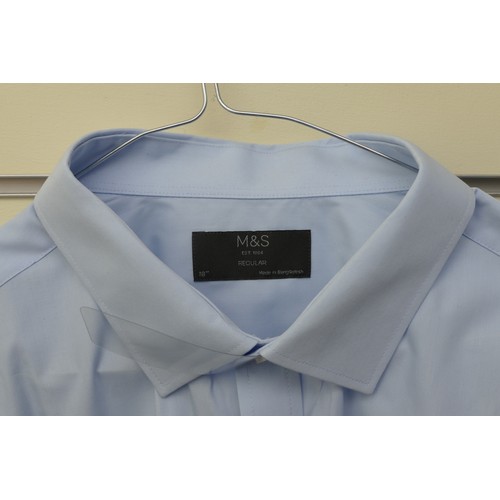 215 - Four shirts in good used condition to include:
Marks & Spencer, light blue, 18