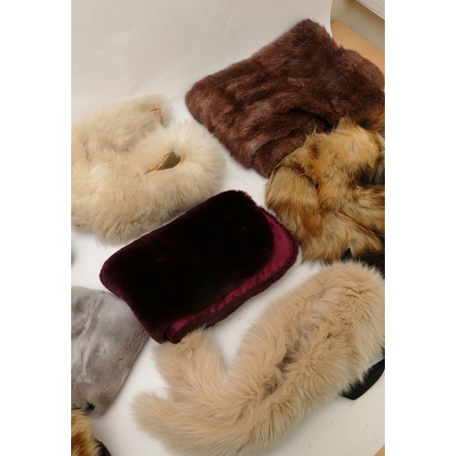 261 - Real and faux fur collars and stoles. To include a black faux fur stole 122 x 18 cm, a burgundy faux... 