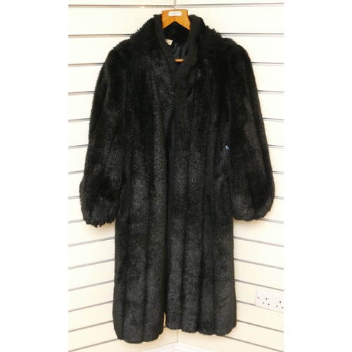 266 - A black faux fur coat, good condition.
size 12, approximately 115cm in length.