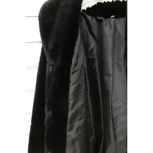 279 - A black 'Faux' fur mid length jacket, side concealed pockets, Size 12/L 98cm.