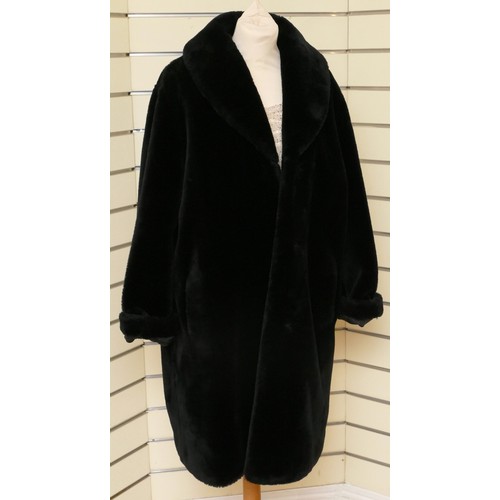 279 - A black 'Faux' fur mid length jacket, side concealed pockets, Size 12/L 98cm.