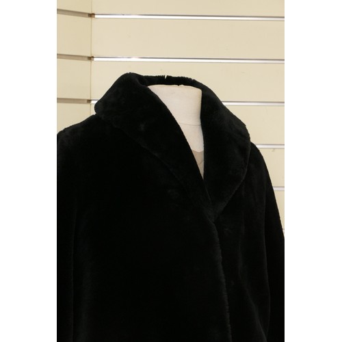 279 - A black 'Faux' fur mid length jacket, side concealed pockets, Size 12/L 98cm.