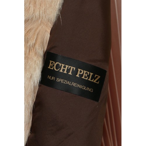 315 - Echt Pelz, line fur gilet, with leather ties, chest 58cm/L 75cm, together with a Passigatti, acrylic... 