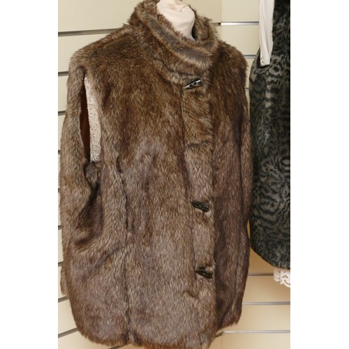 316 - Isle lined faux fur brown gilet, toggle fastening, extra large/L 66cm, together with a Per Una suede... 