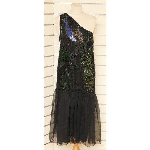 338 - A flapper style single shoulder, beaded and netted evening gown with peacock beaded feature front, t... 