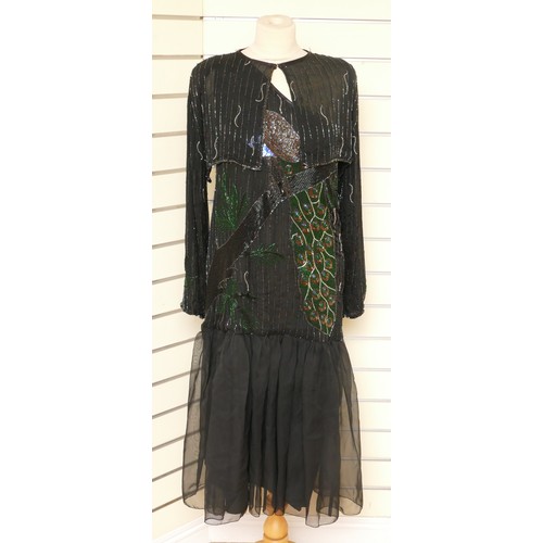 338 - A flapper style single shoulder, beaded and netted evening gown with peacock beaded feature front, t... 