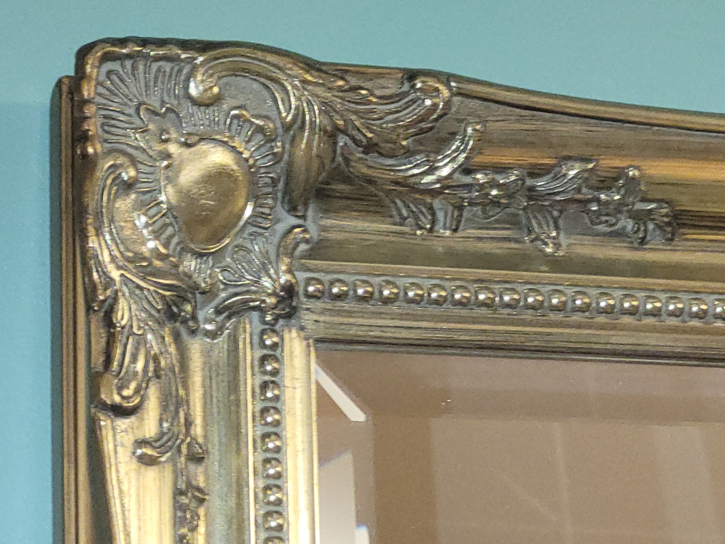 A contemporary gilt framed bevel edged rectangular wall mirror, 112x76cm