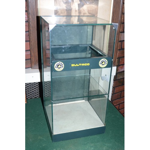 305 - A black metal and glass table top display case with Bultaco stickers, 70 x 35 cm.