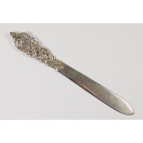 74 - A Scandinavian 830 silver letter opener, with cast floral handle, inscribed Island20cm, 51gm