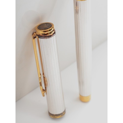 88 - Watermans, a silver and gold plated limited edition plunger filling fountain pen, with 18K gold nib,... 