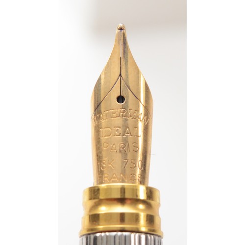 88 - Watermans, a silver and gold plated limited edition plunger filling fountain pen, with 18K gold nib,... 