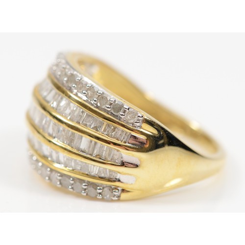 105 - A 9ct gold diamond dress ring, three channel set rows of baguette cut diamonds flanked by two rows o... 