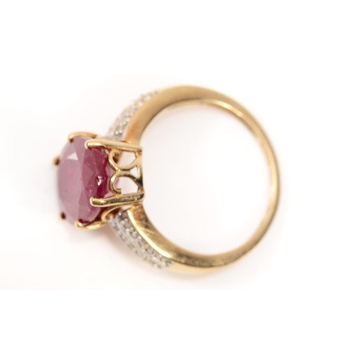 108 - A 9ct gold glass filled ruby cocktail dress ring, with eight cut diamond set shoulders, O, 3.9gm.